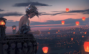 woman standing on terrace surround by sky lanterns