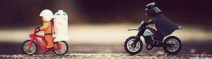 two LEGO men riding motorcycle mini figure