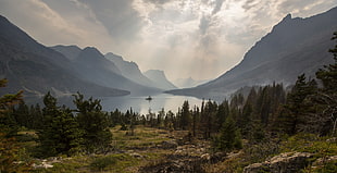 landscape photograph of lake in between mountainous region HD wallpaper
