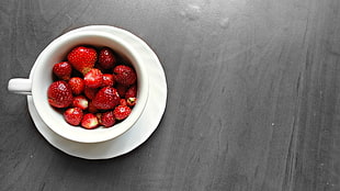 strawberries in white ceramic mug