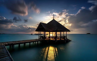 black and brown table lamp, pier, hut, water, clouds