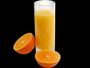 slice oranges with orange juice on drinking glass