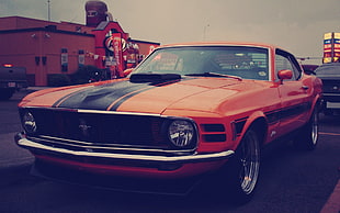 classic red and black Ford Mustang