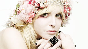 woman floral headband with silver-colored signet ring posing for photo