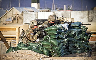 green and brown ceramic figurine, soldier, military, gun, sandbag