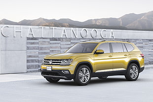 yellow Volkswagen SUV parked beside Chattanooga wall HD wallpaper