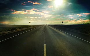 gray road under sunrays during dawn HD wallpaper