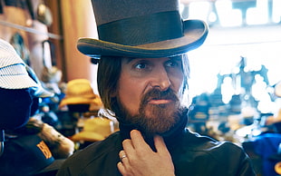 closeup photo of man in black hat