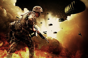 soldier holding rifle near soldiers with parachutes HD wallpaper
