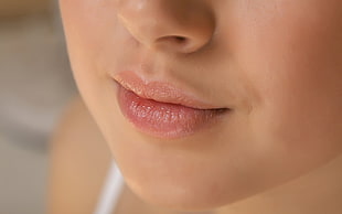 person's lips close up photo