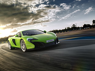 speed photography of green coupe