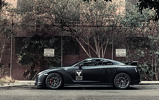 photography of black sports coupe