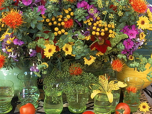 assorted colored flower pot with glass vases