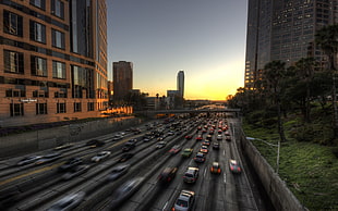 time lapse photo of cars between buildings, cityscape, city, building, sunset