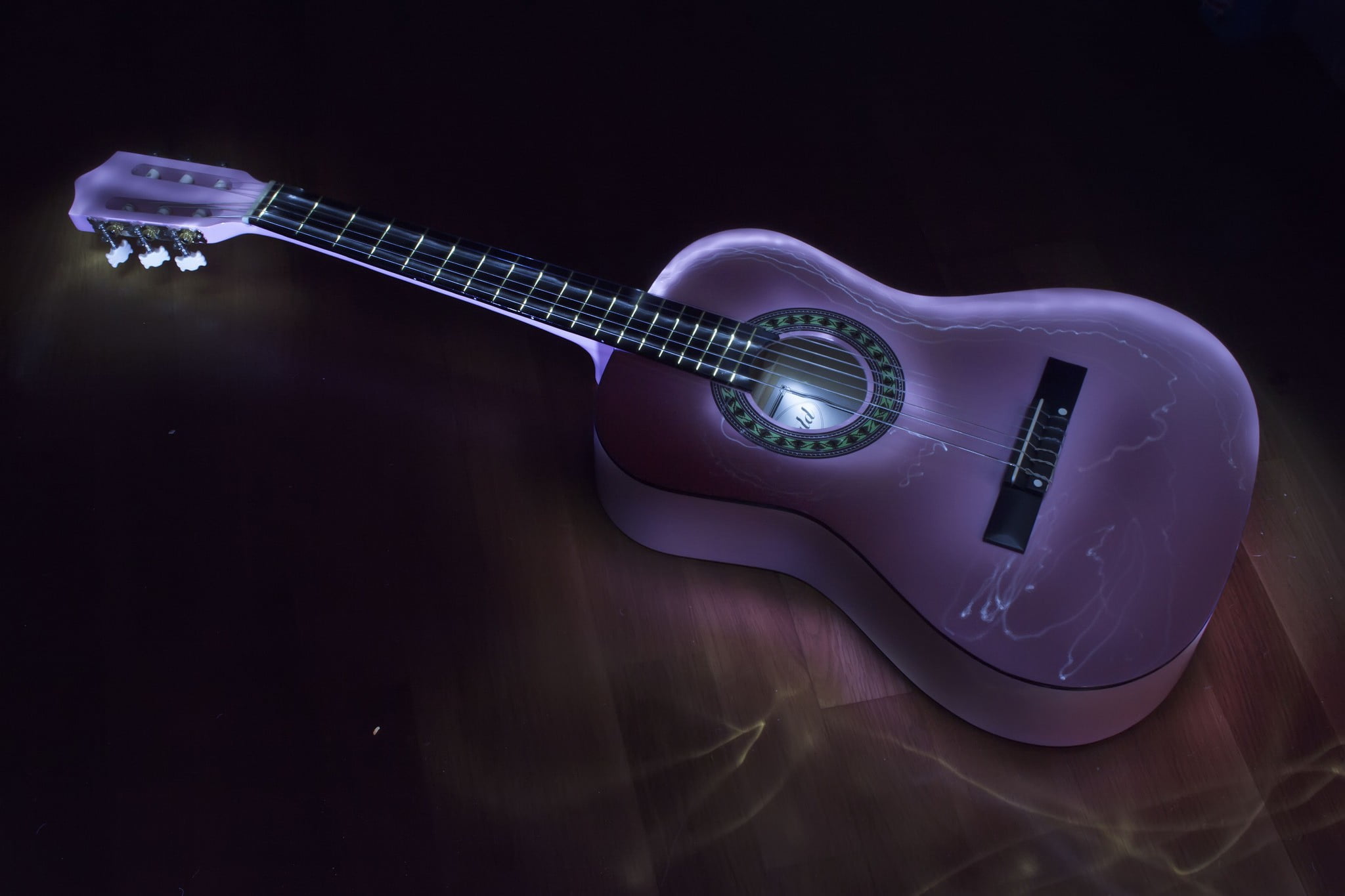 Purple and black acoustic guitar, music