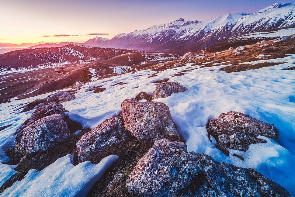 gray rocks surrounded by snow at daytime, mountains, landscape, sunset HD wallpaper