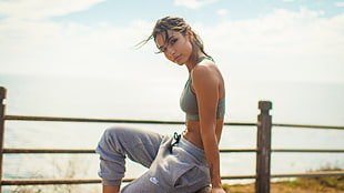 woman wearing gray sports bra and drawstring pants outdoors