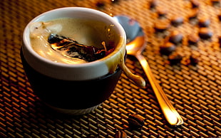 espresso spilling out near coffee beans HD wallpaper