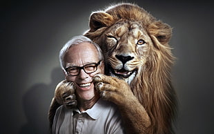 photo of smiling lion and man