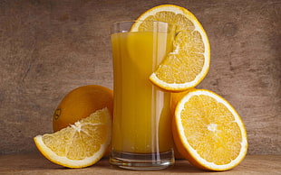 clear highball glass with orange juice and sliced orange citrus HD wallpaper