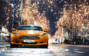 orange car, Aston Martin, street, street light, reflection