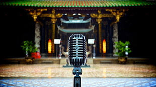 selective focus of condenser microphone facing temple HD wallpaper