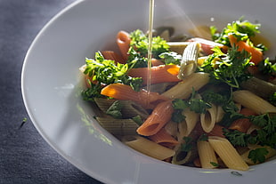 pasta with green vegetables on white plate