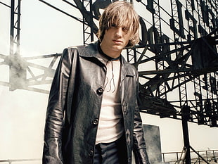 man in blonde hair and black leather jacket