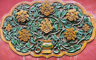green and brown ceramic wall decor