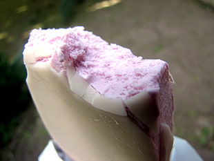 white and pink bitten ice cream