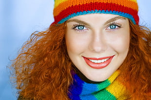 woman's blond hair wearing multi-colored beanie