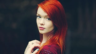 red haired woman in red top