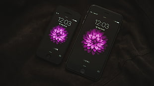 space gray iPhone 6 and black iPhone 5 on black texture