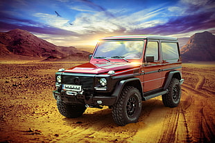 red and black Mercedes-Benz G-class SUV on dessert during daytime