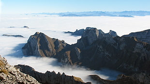 aerial photography of fog covered mountain