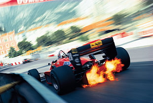 time lapse photography of red racing vehicle