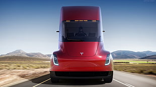 red Tesla truck during daytime