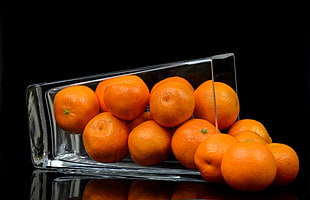 oranges with clear drinking glass