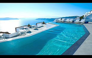six white pool loungers, hotel, swimming pool