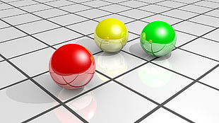 three yellow, red, and green balls