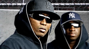 two men in black full-zip hoodie wearing black sunglasses with black snapback during day time