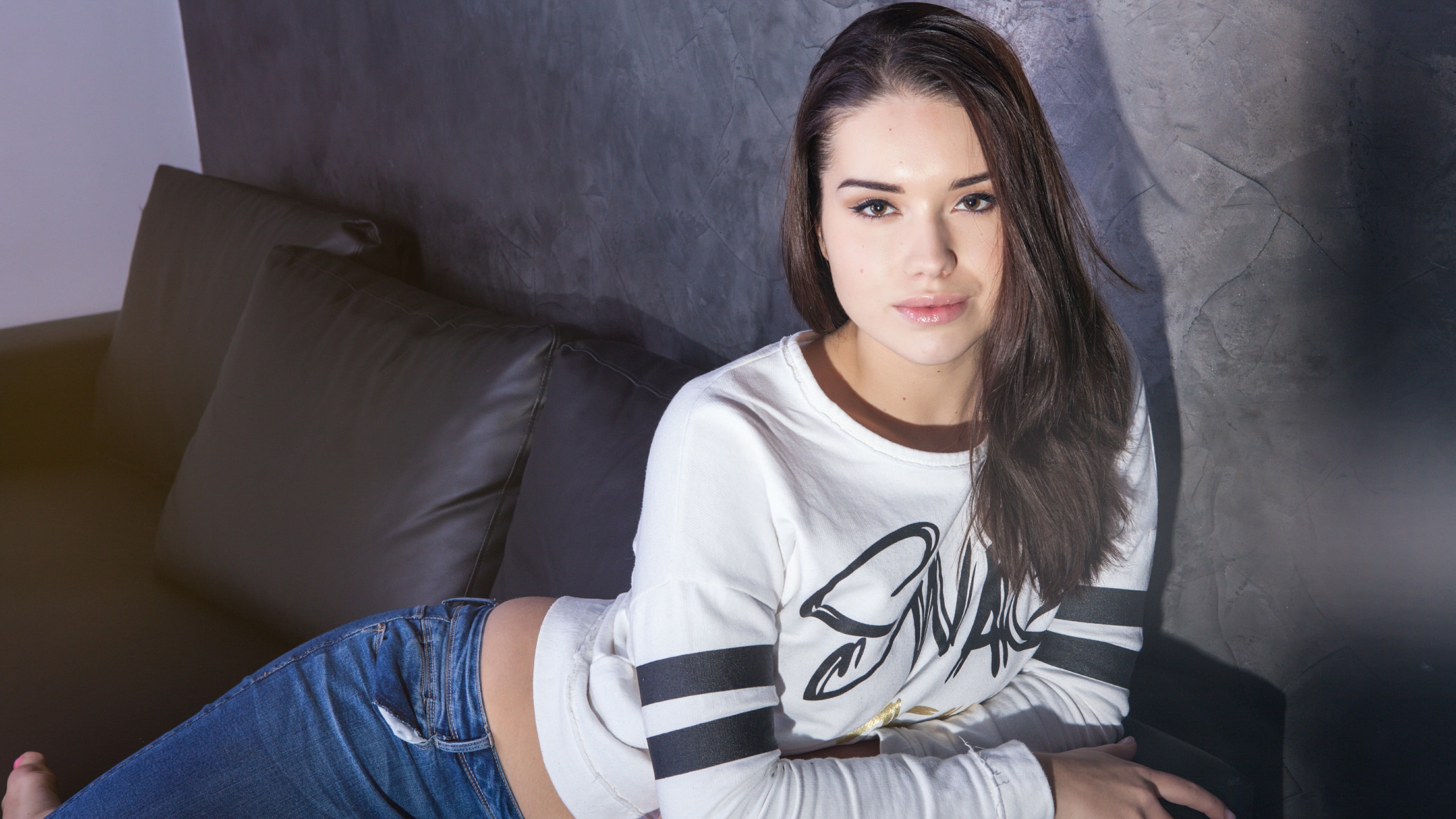 woman wearing white sweatshirt and blue jeans during photography