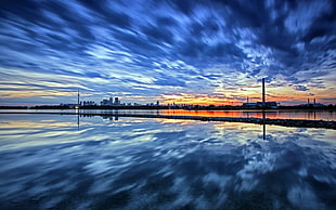landscape photography of blue sky mirrored on water