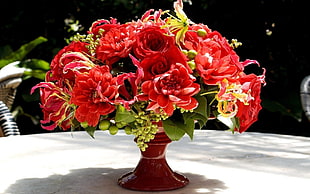 orange bouquet of flowers in red vase HD wallpaper