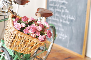 pink roses in brown basket