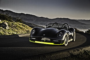 black convertible in the middle of the road HD wallpaper