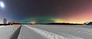 landscape photography of snowy ground during aurora borealis HD wallpaper