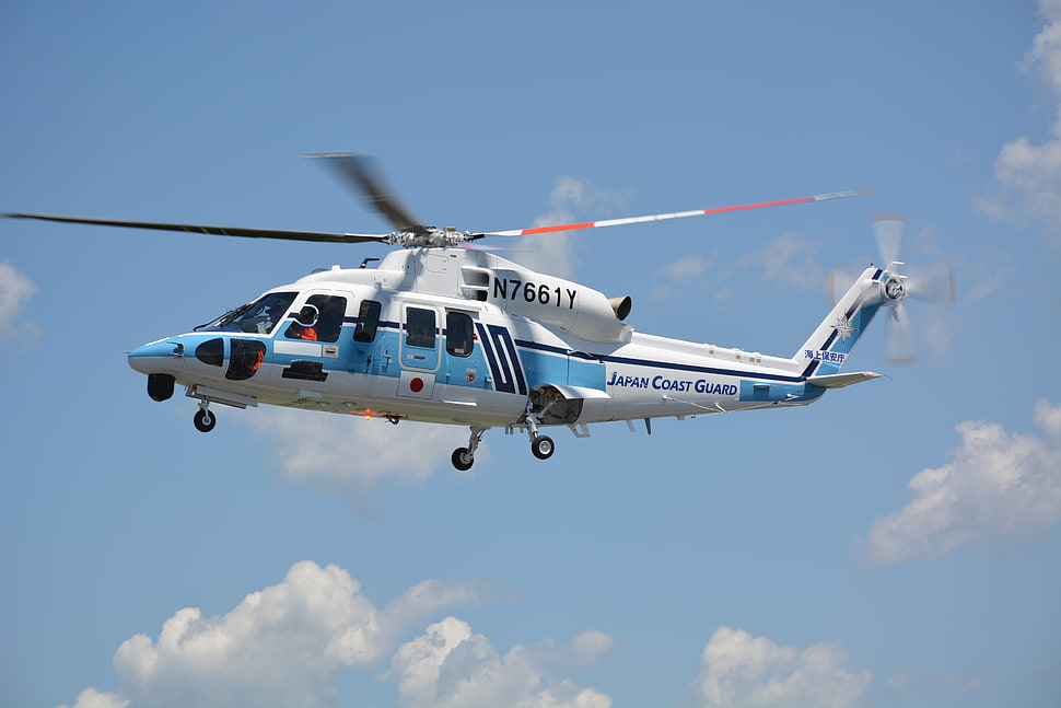 white and blue helicopter flying with N7661Y model HD wallpaper