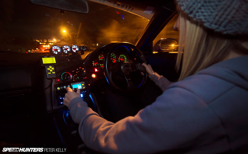 woman holding steering wheel during nighttime HD wallpaper