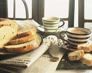 baked bread with mugs of coffee